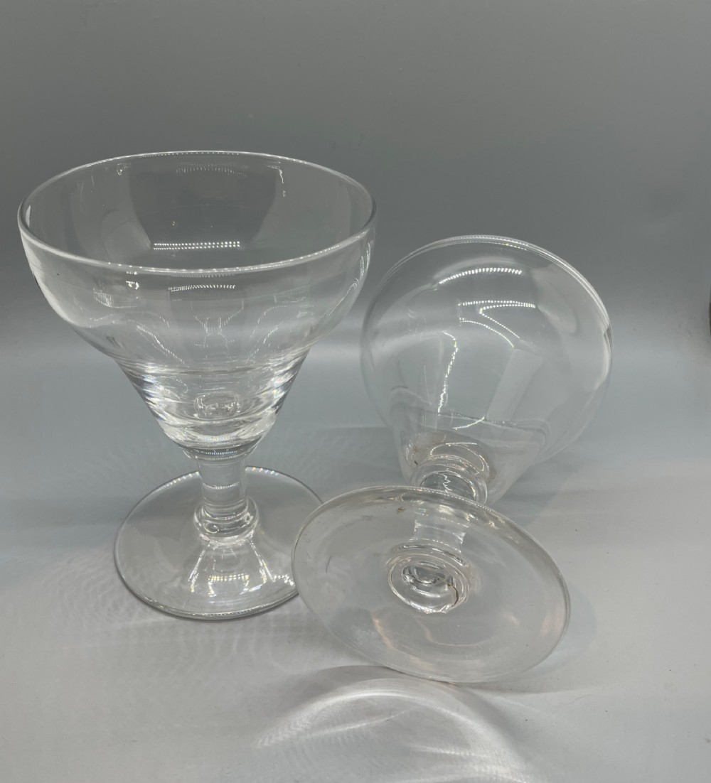 A matched pair of clear Georgian glass rummers featuring ogee-shaped bowls, short stems, and circular flat feet. View IV