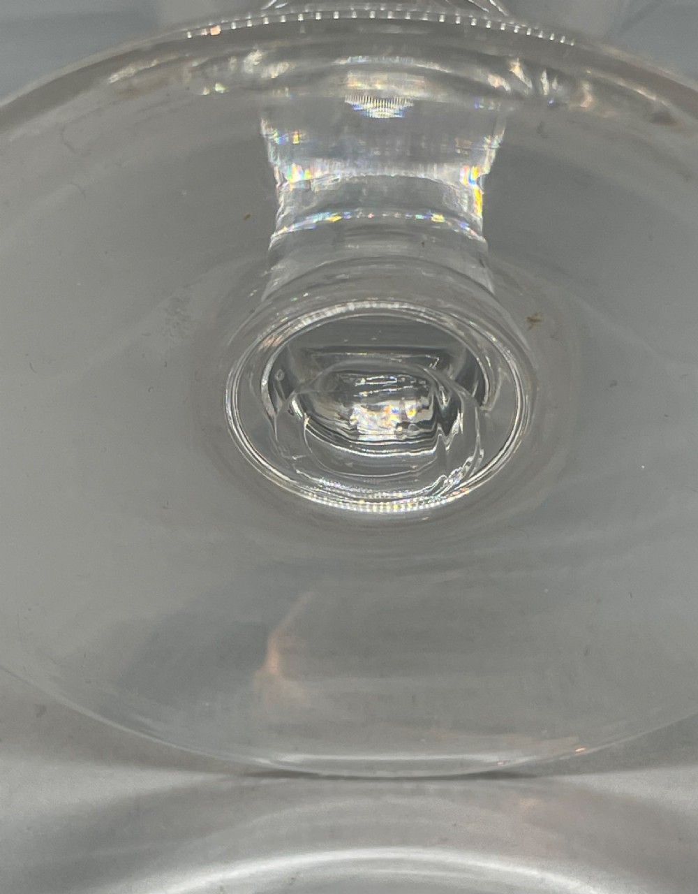A matched pair of clear Georgian glass rummers featuring ogee-shaped bowls, short stems, and circular flat feet. View VII