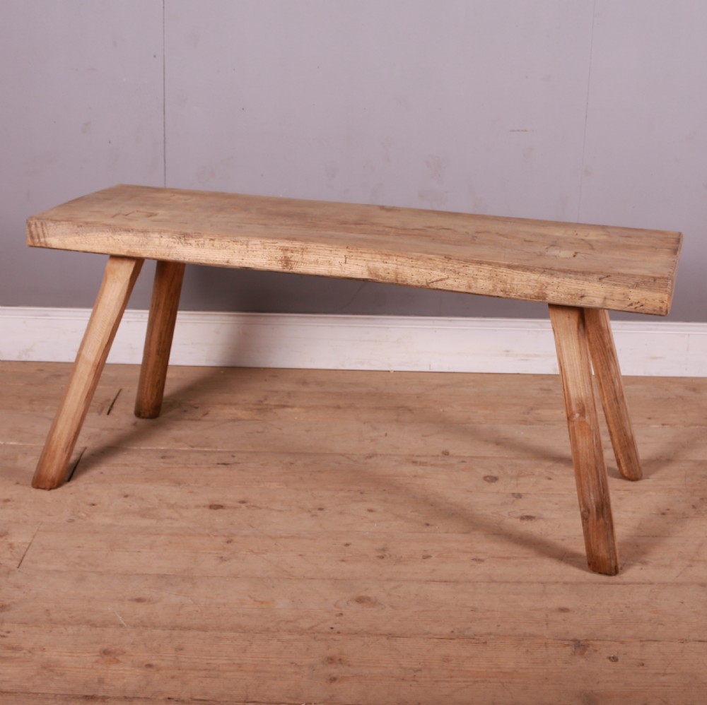 A rectangular wooden trestle table crafted from pale scrubbed timber with four angled splayed legs. View III