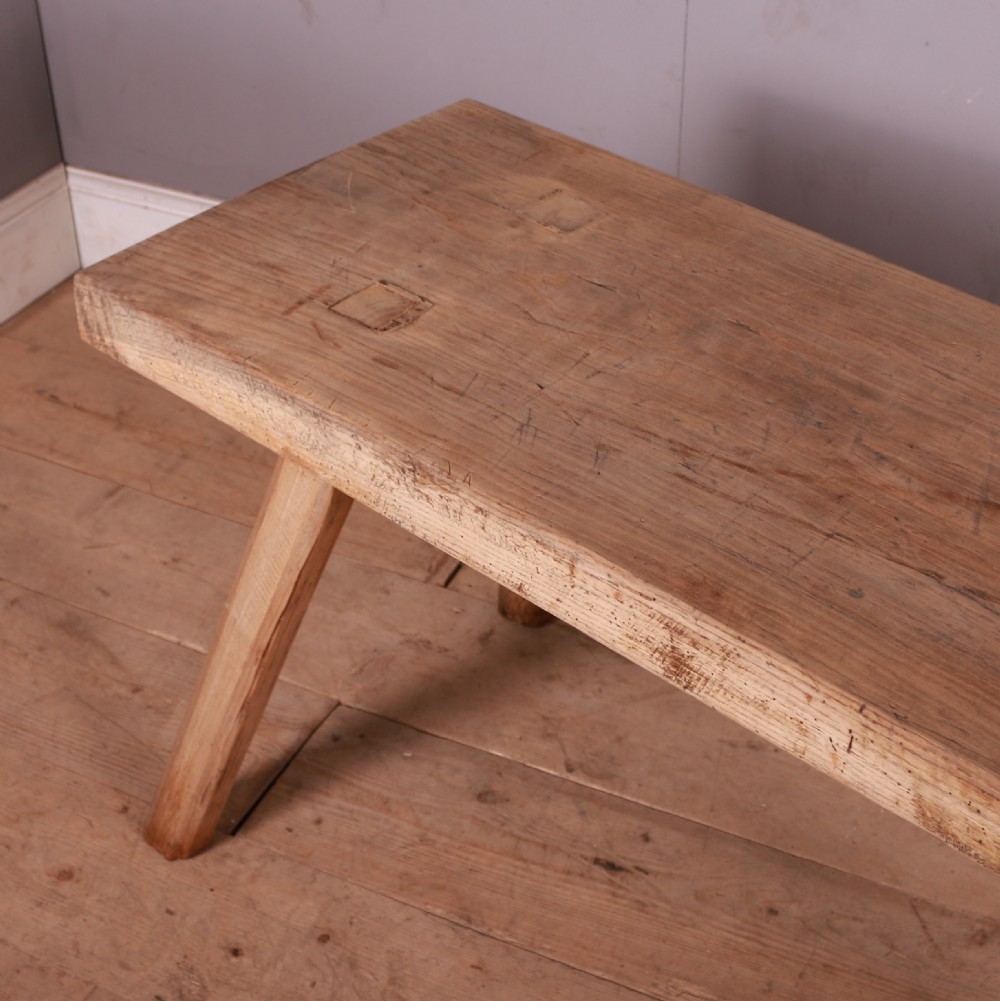 A rectangular wooden trestle table crafted from pale scrubbed timber with four angled splayed legs. View IV