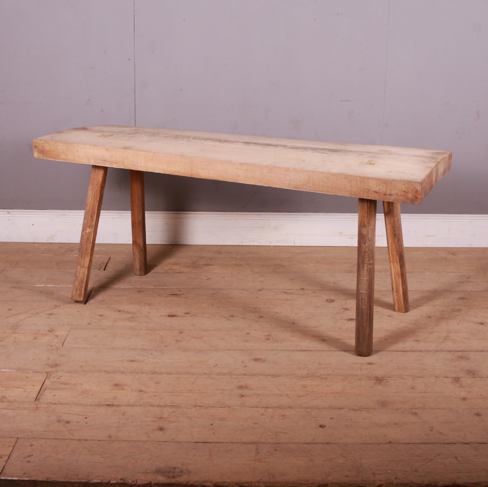 A rustic French trestle table crafted from scrubbed sycamore and elm featuring a thick rectangular top supported by splayed timber legs. View II