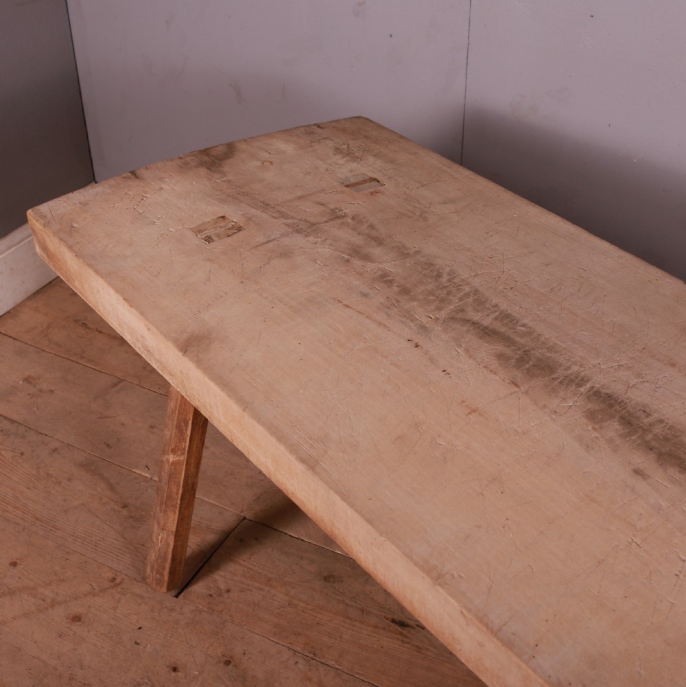 A rustic French trestle table crafted from scrubbed sycamore and elm featuring a thick rectangular top supported by splayed timber legs. View IV