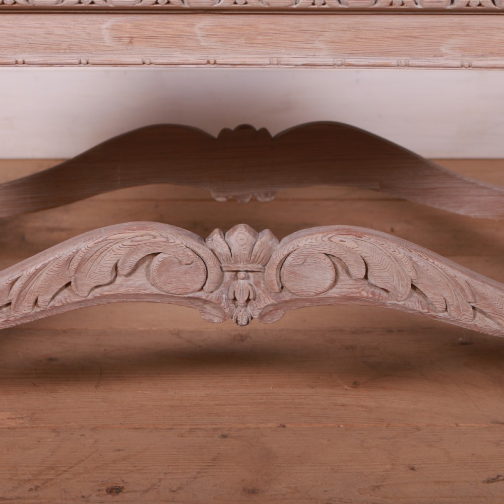 A low rectangular Dutch bleached pine coffee table featuring acanthus leaf carvings, ornate scrolled stretchers, claw feet, and an inset glass top. View VI
