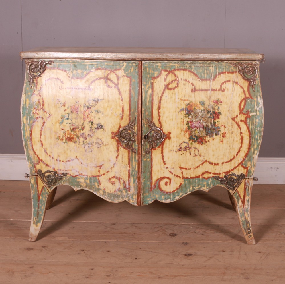 A Venetian serpentine painted wooden buffet cabinet featuring hand-painted floral cartouches, a polychrome green and cream finish, and metal corner mounts. View II
