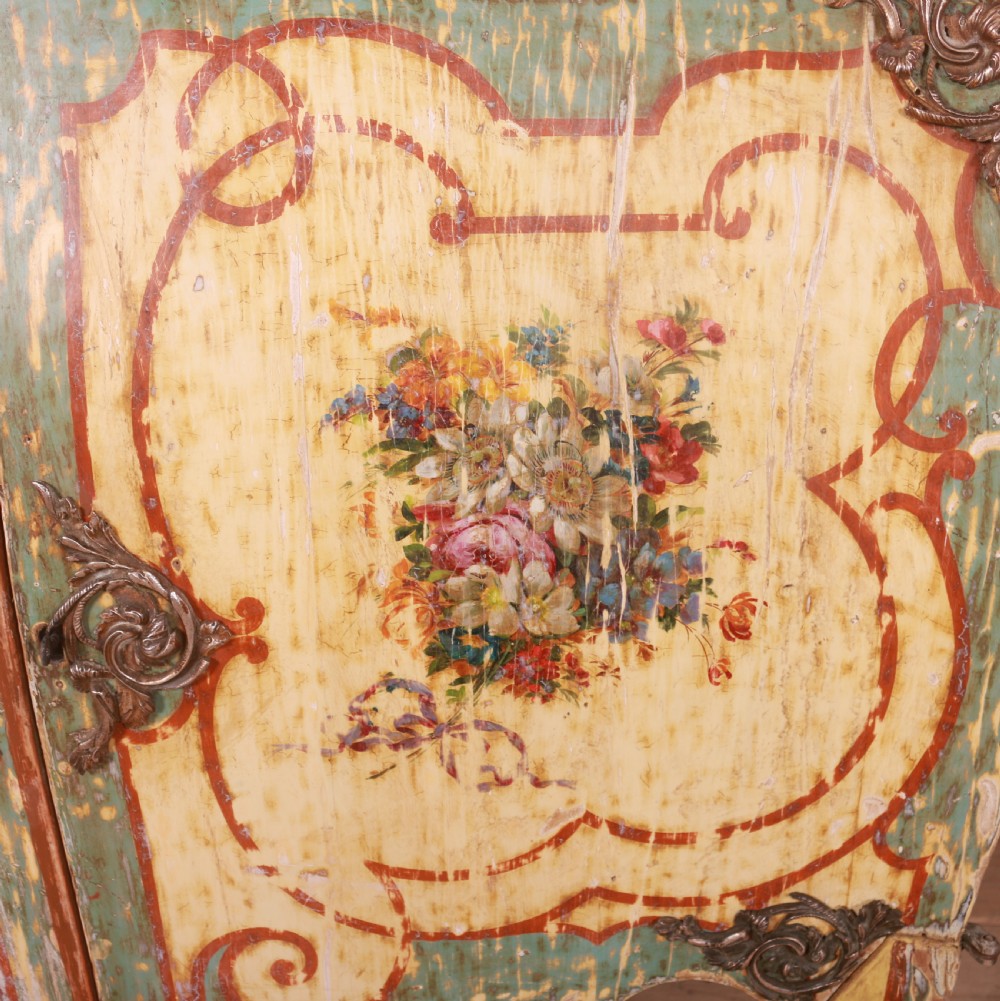 A Venetian serpentine painted wooden buffet cabinet featuring hand-painted floral cartouches, a polychrome green and cream finish, and metal corner mounts. View III