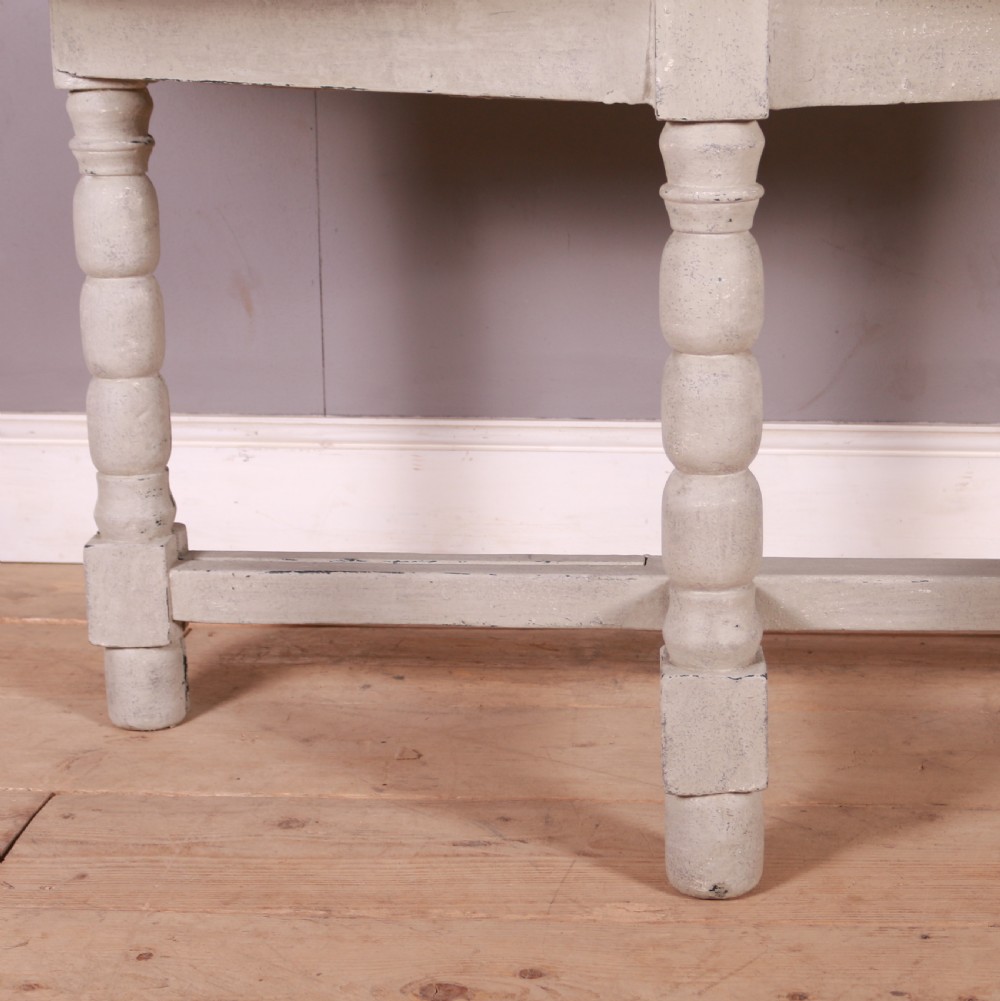 A semi-circular painted Dutch console table with a grey top, off-white apron, turned legs, and a lower stretcher base. View II