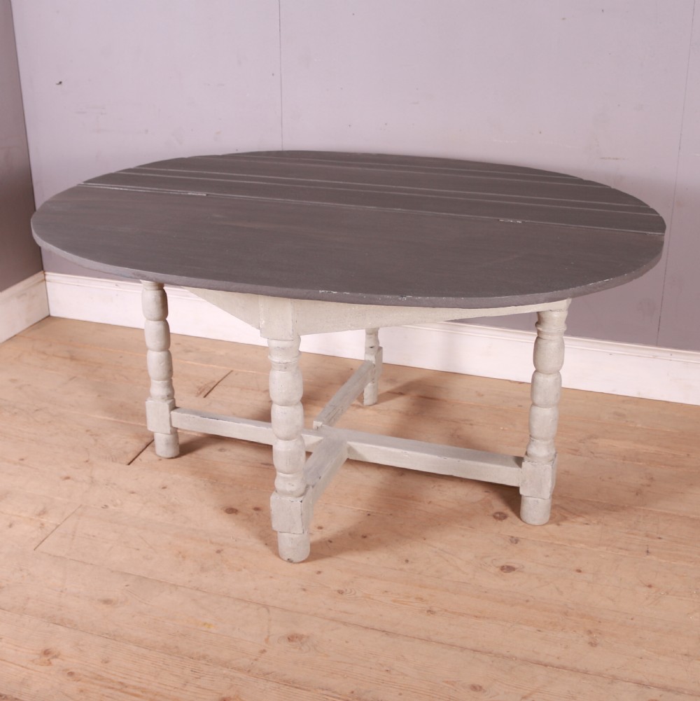 A semi-circular painted Dutch console table with a grey top, off-white apron, turned legs, and a lower stretcher base. View IV