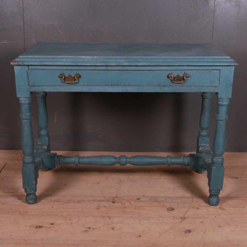 A blue painted side table featuring a single drawer with two brass handles, turned legs, and lower stretchers. View III