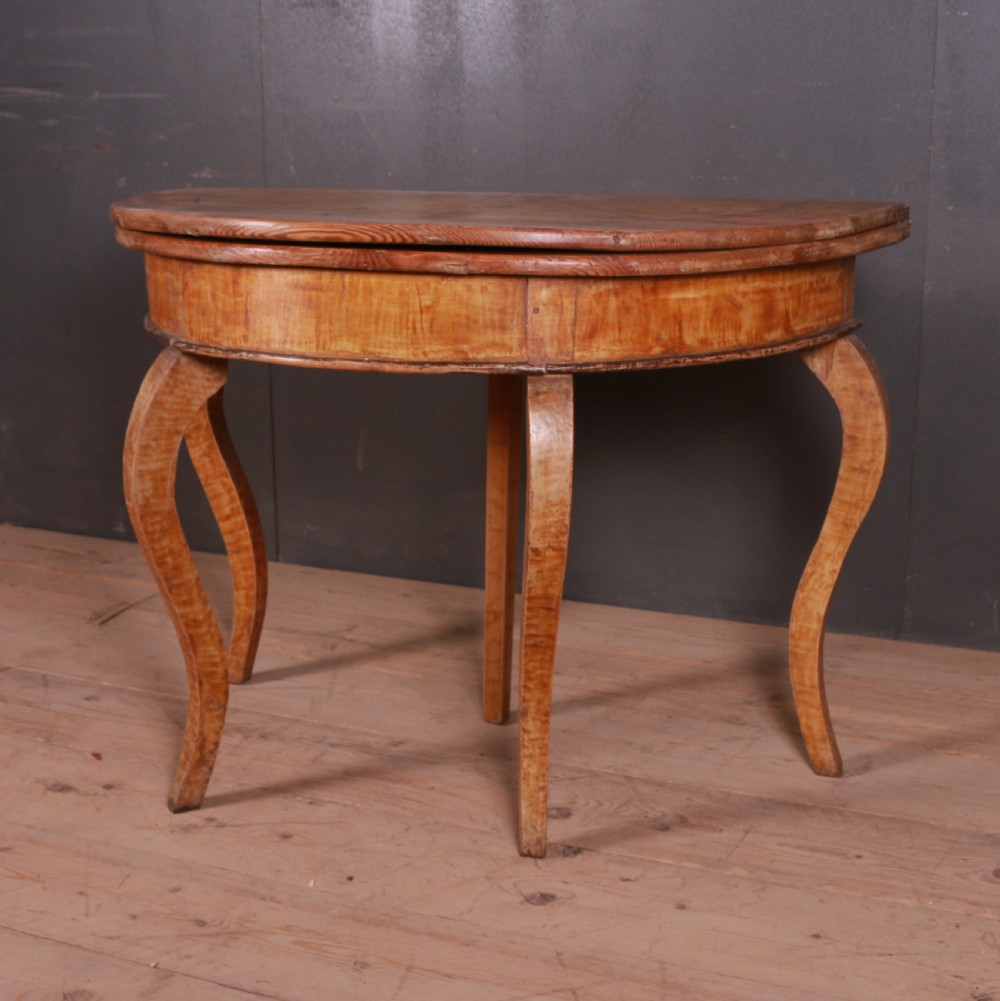 A semi-circular Swedish wooden console table featuring four slender cabriole legs, a fifth gateleg, and a flip-top surface. View II
