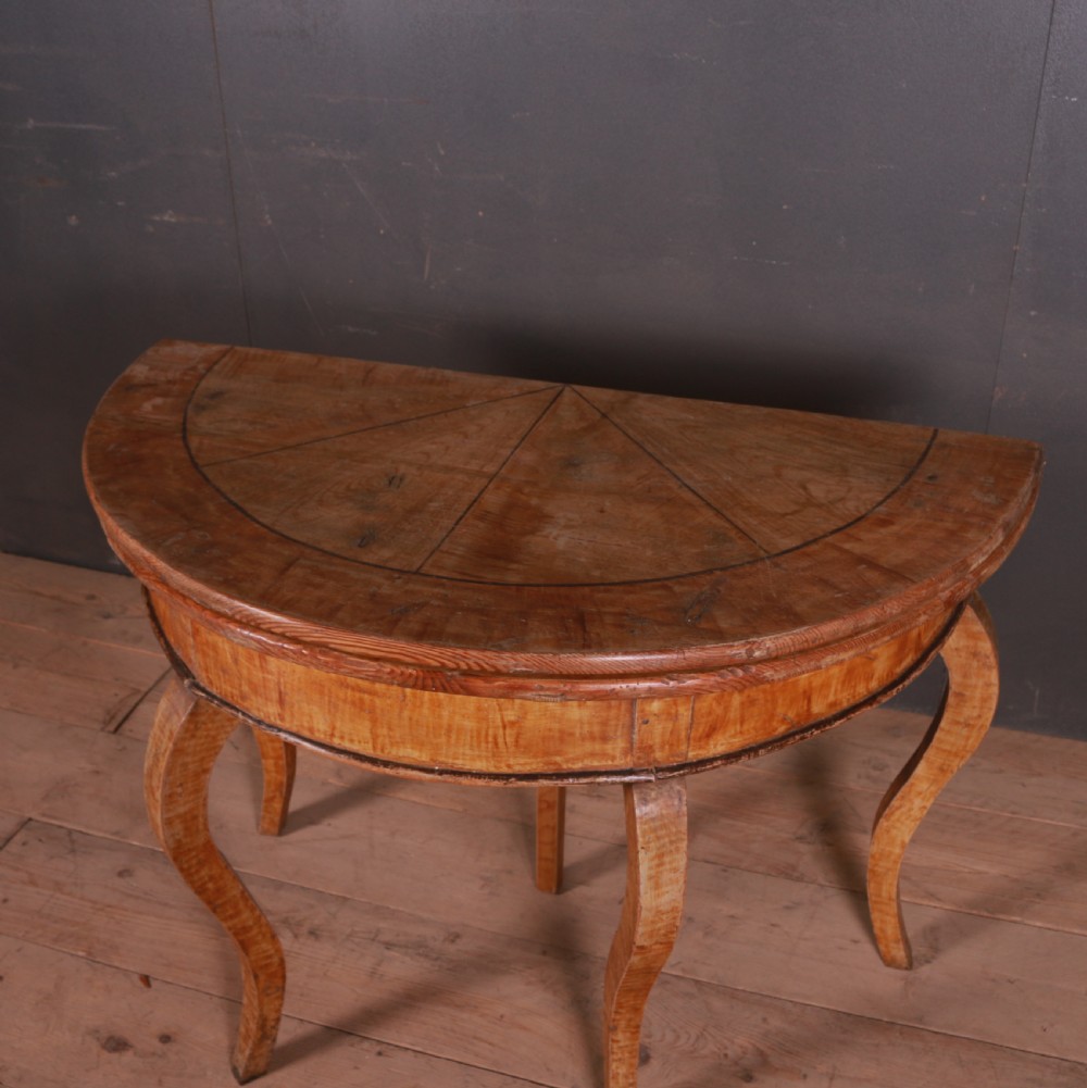 A semi-circular Swedish wooden console table featuring four slender cabriole legs, a fifth gateleg, and a flip-top surface. View III