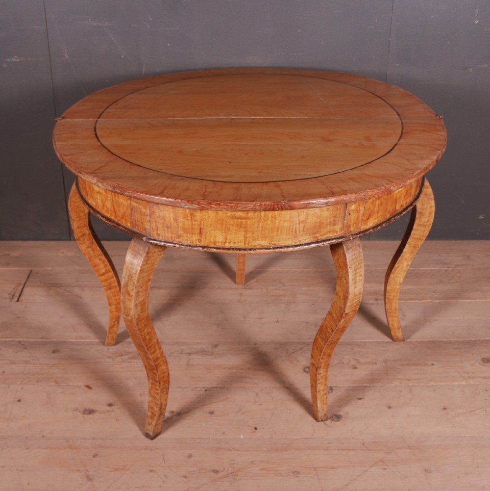A semi-circular Swedish wooden console table featuring four slender cabriole legs, a fifth gateleg, and a flip-top surface. View V