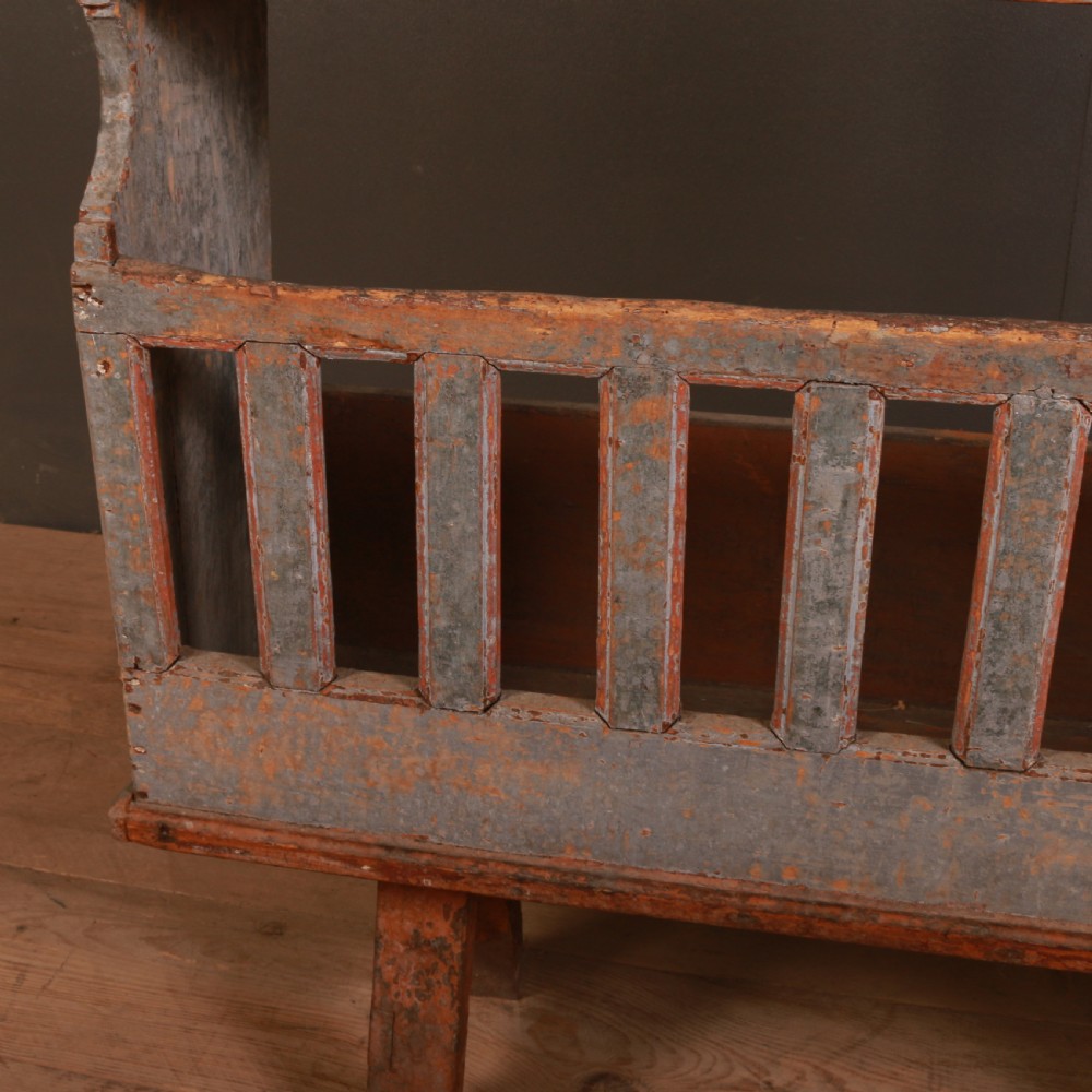An antique French painted wooden vaisselier dresser featuring upper display shelves and a spindled lower gallery supported on trestle feet. View II