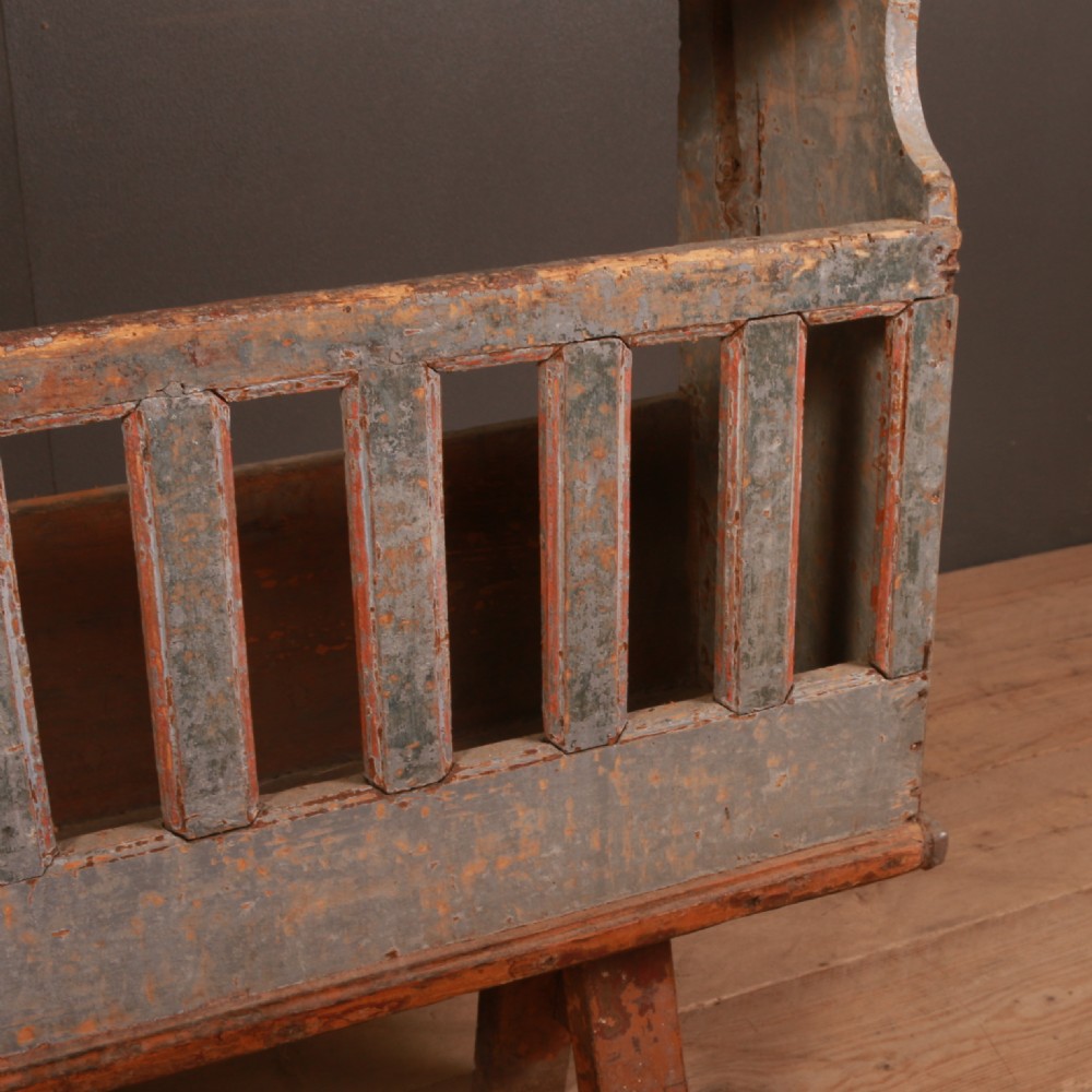 An antique French painted wooden vaisselier dresser featuring upper display shelves and a spindled lower gallery supported on trestle feet. View V