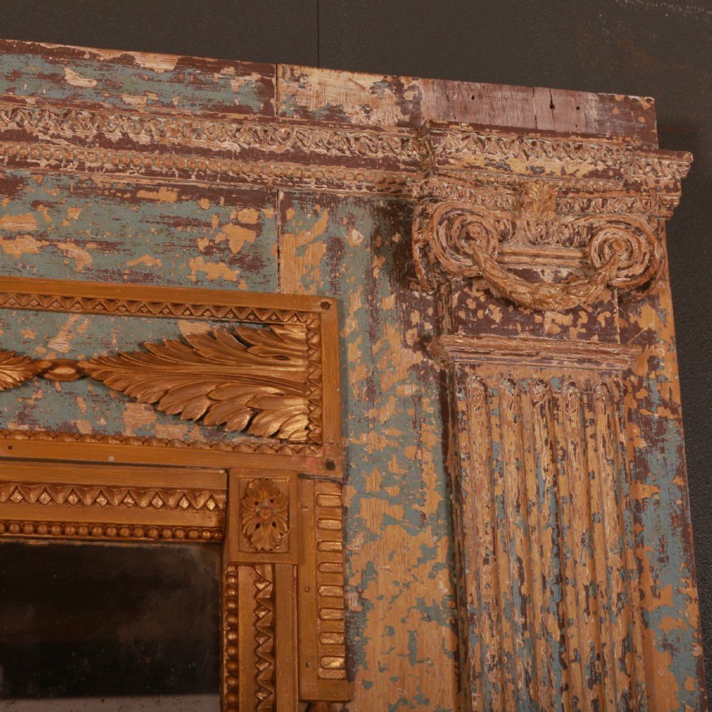 A large rectangular antique French mirror with fluted pilasters, carved gilded leaf mouldings, distressed duck egg blue paintwork, and a foxed glass plate. View IV