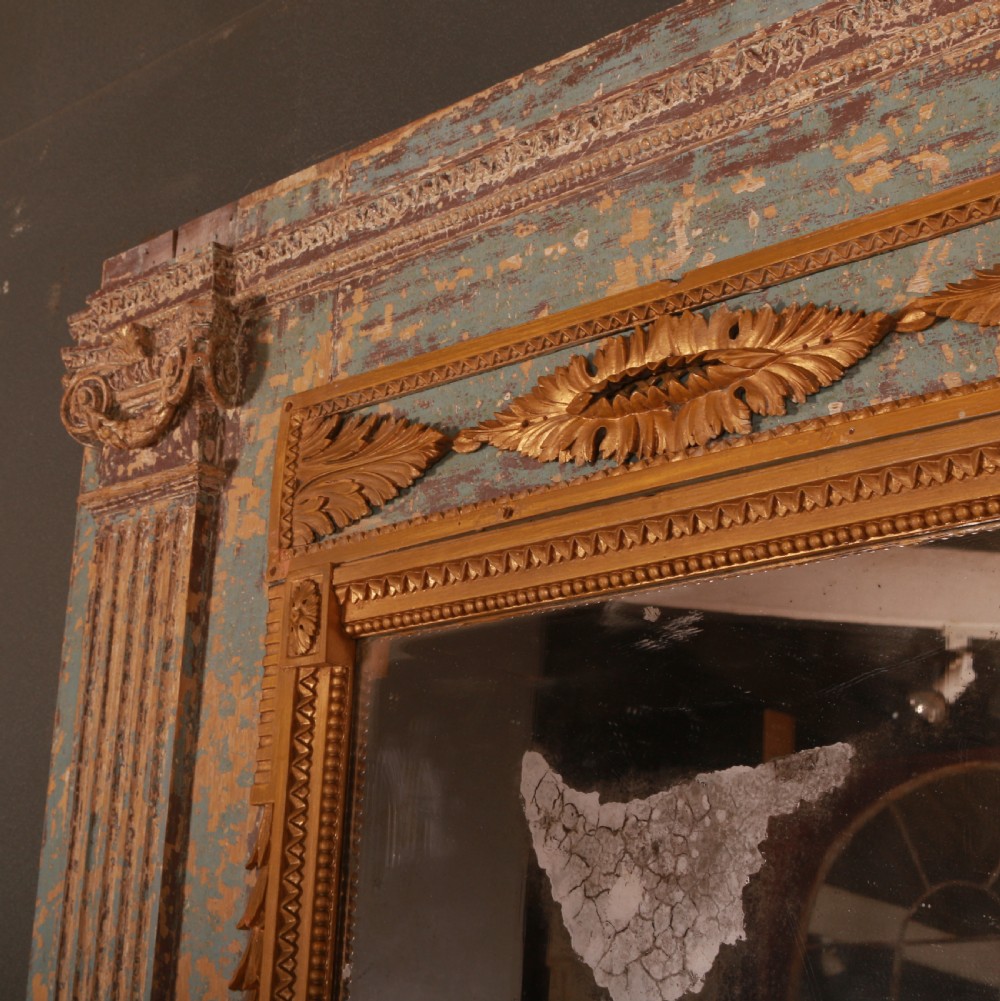 A large rectangular antique French mirror with fluted pilasters, carved gilded leaf mouldings, distressed duck egg blue paintwork, and a foxed glass plate. View V