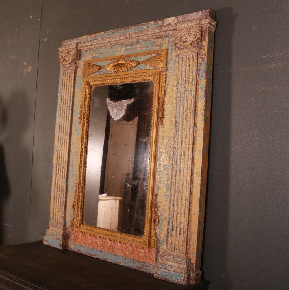 A large rectangular antique French mirror with fluted pilasters, carved gilded leaf mouldings, distressed duck egg blue paintwork, and a foxed glass plate. View VI