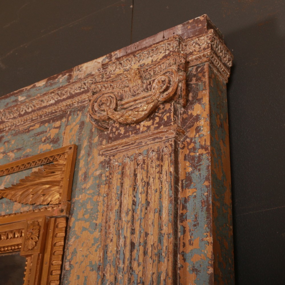 A large rectangular antique French mirror with fluted pilasters, carved gilded leaf mouldings, distressed duck egg blue paintwork, and a foxed glass plate. View VII