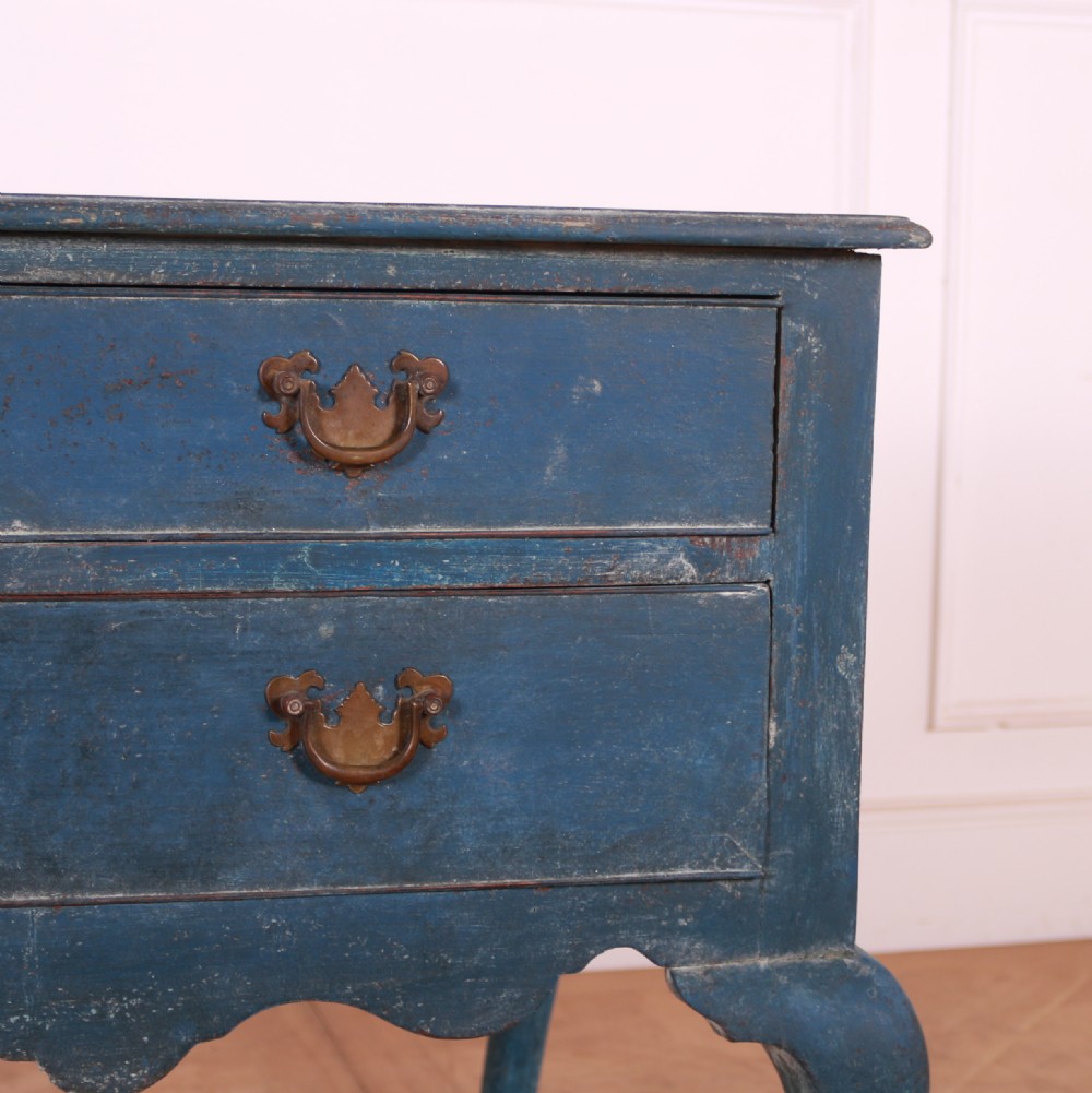 An eighteenth-century blue painted lowboy featuring three drawers with brass handles, a scalloped apron, and cabriole legs. View III