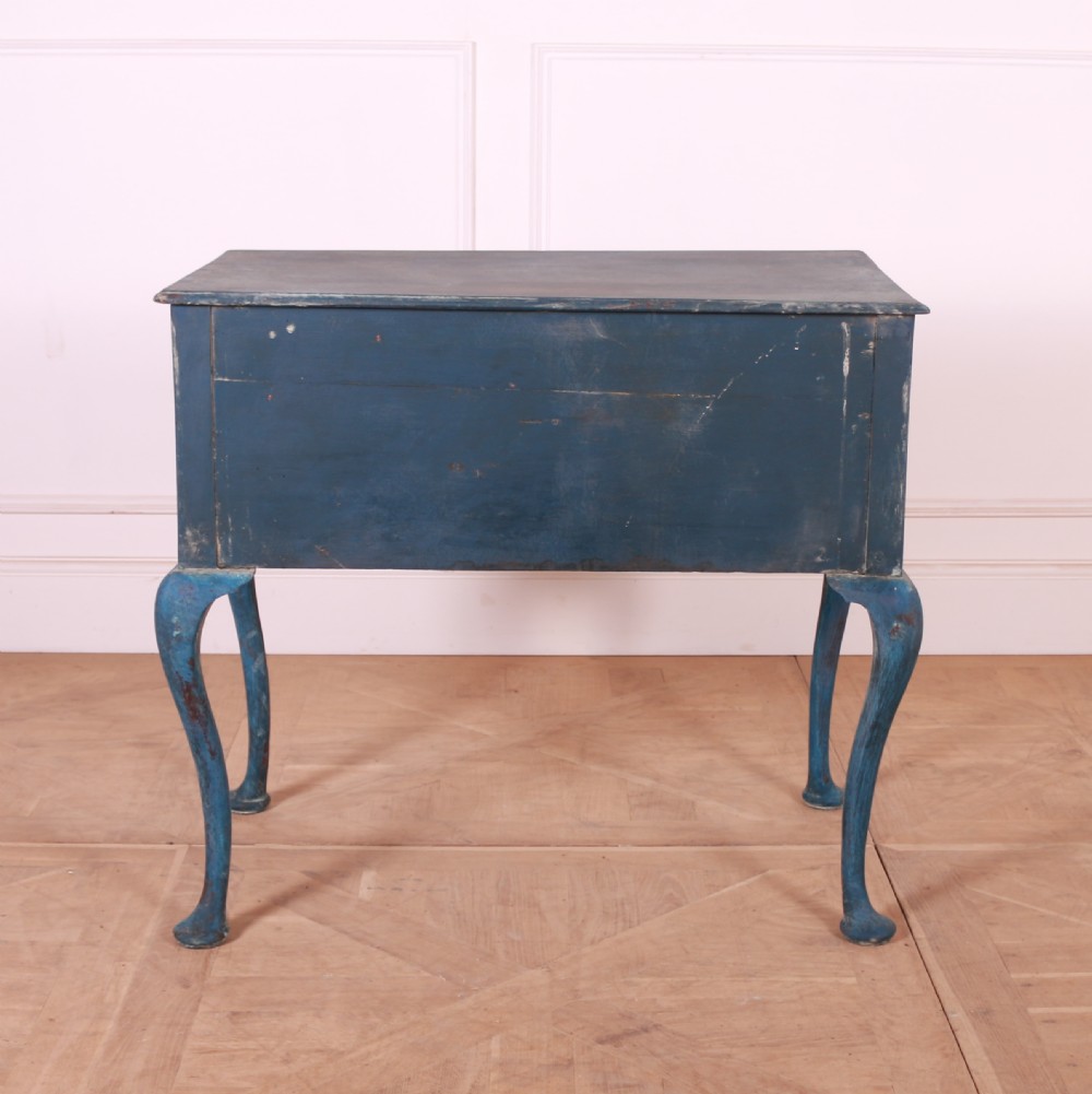 An eighteenth-century blue painted lowboy featuring three drawers with brass handles, a scalloped apron, and cabriole legs. View VII