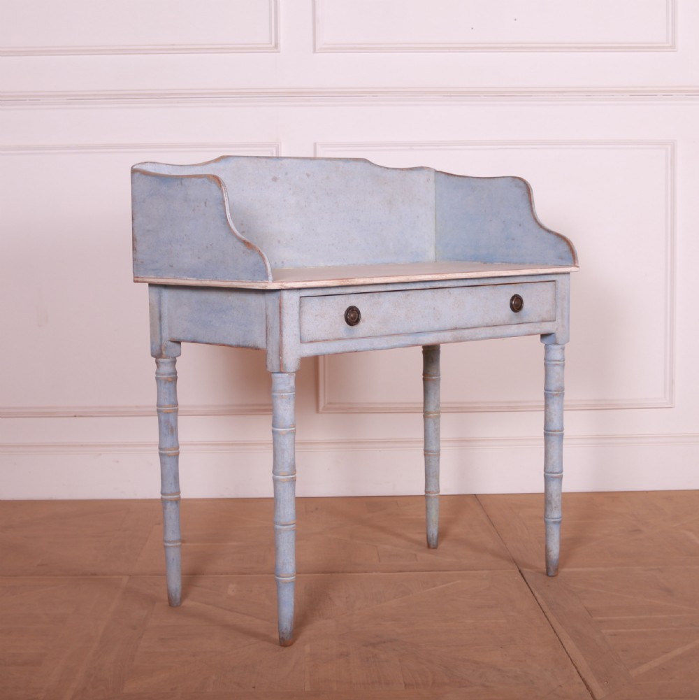 A pale blue painted side table featuring a raised gallery back, single drawer with two circular metal knobs, and ring-turned legs. View II