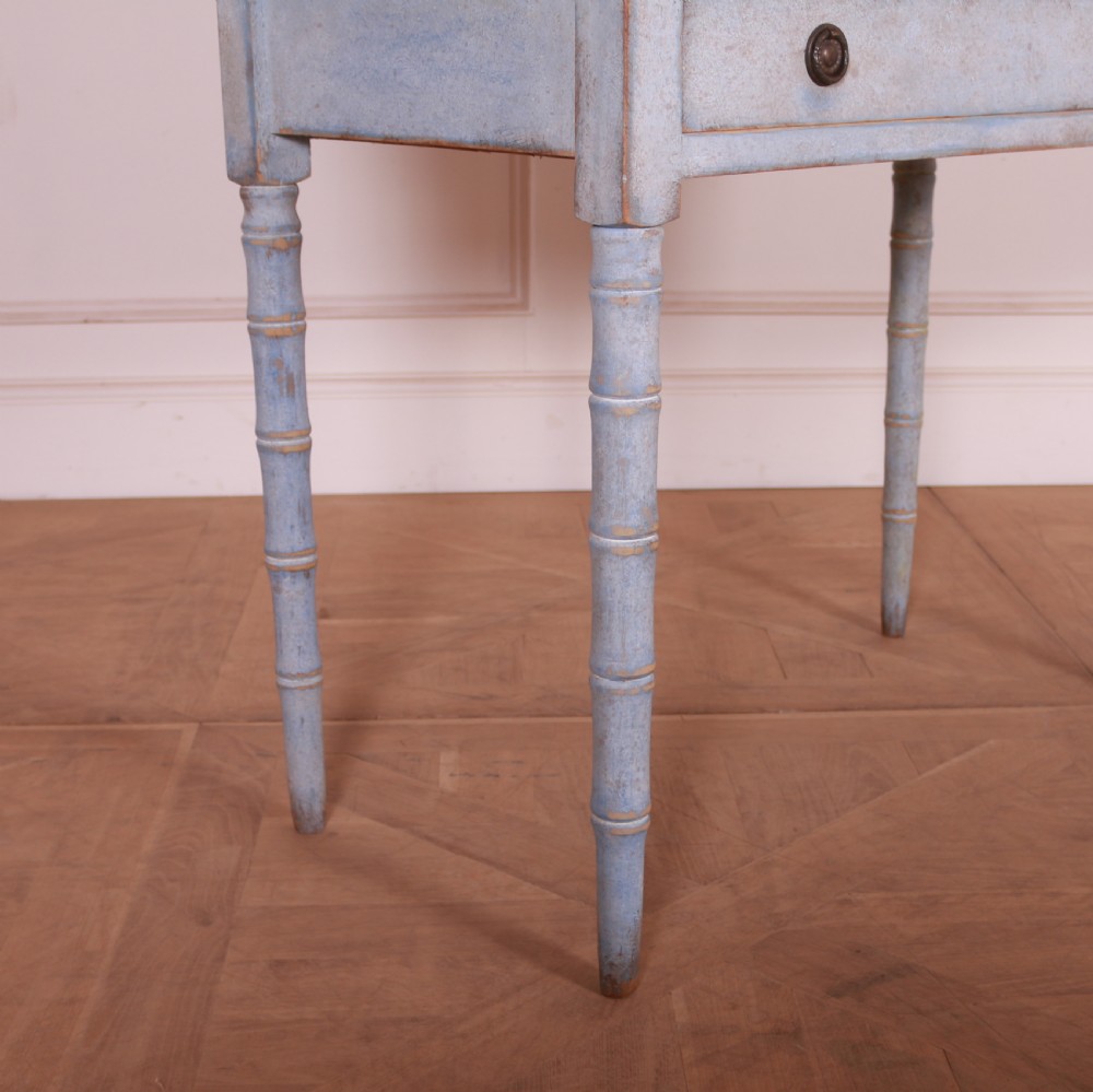 A pale blue painted side table featuring a raised gallery back, single drawer with two circular metal knobs, and ring-turned legs. View IV