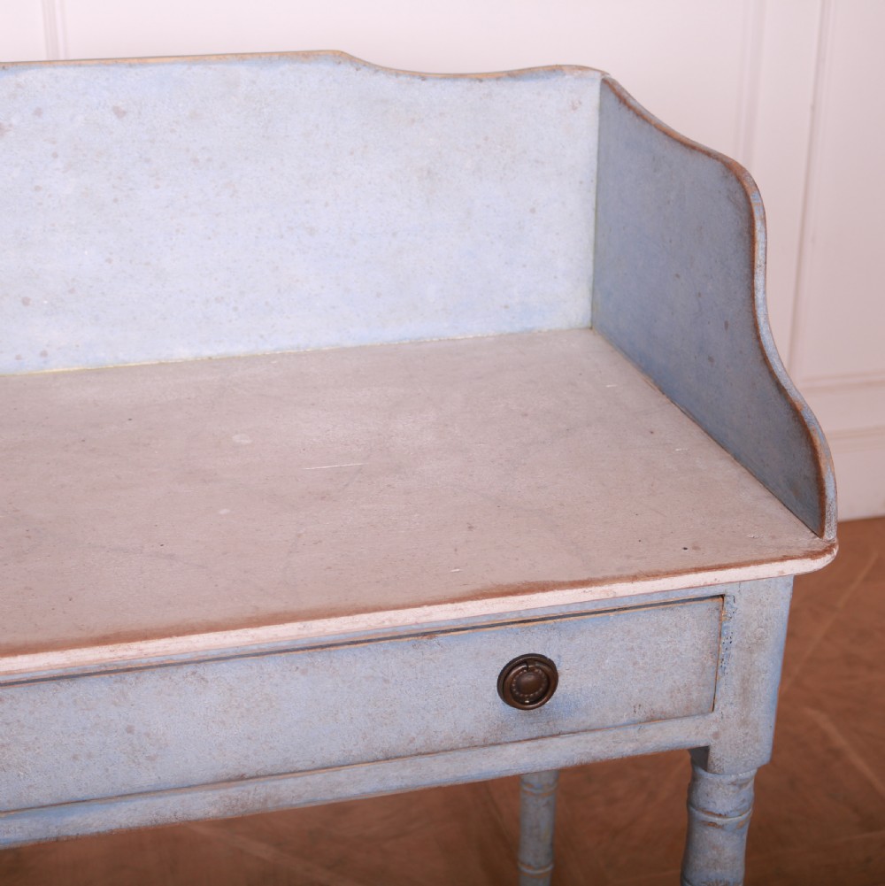 A pale blue painted side table featuring a raised gallery back, single drawer with two circular metal knobs, and ring-turned legs. View VIII