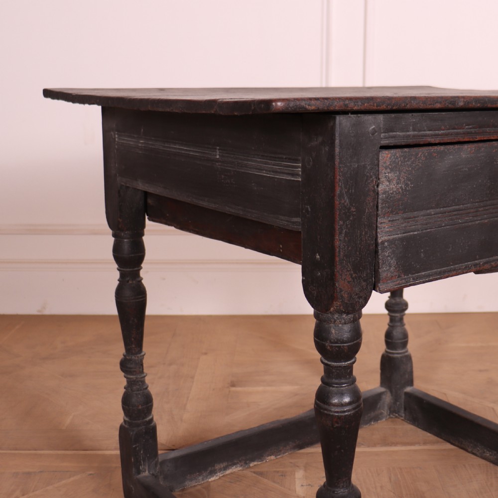 An 18th-century dark painted wooden side table with a single drawer, turned legs, and low box stretchers. View II