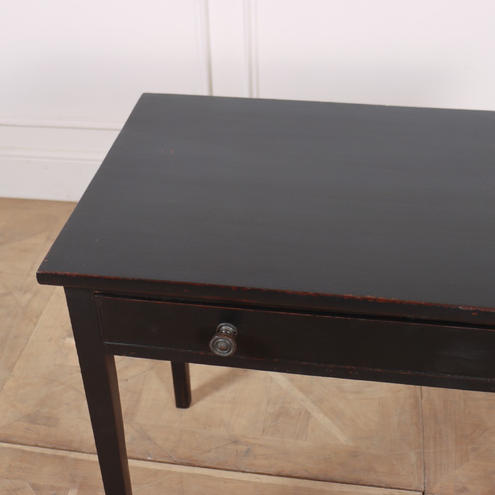 A dark painted rectangular wooden lamp table featuring a single frieze drawer with two circular metal knobs and four square legs. View V