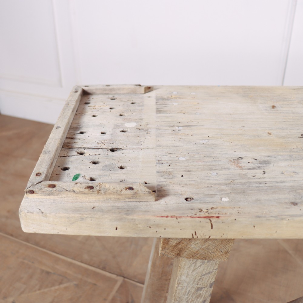 A narrow French bleached oak trestle table featuring a slim rectangular timber top supported by angled trestle legs with diagonal cross bracing. View V