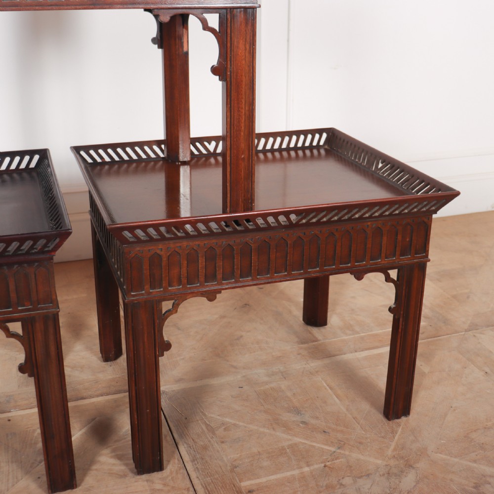 A set of three dark mahogany lamp tables featuring pierced gallery rims and Gothic arch fretwork aprons. View III