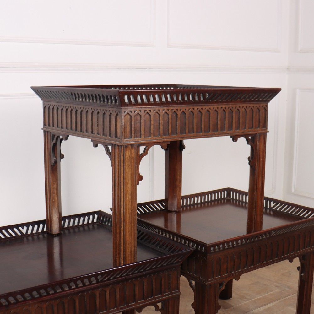 A set of three dark mahogany lamp tables featuring pierced gallery rims and Gothic arch fretwork aprons. View VIII