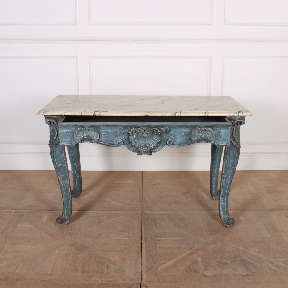 An 18th-century Italian Rococo console table featuring a grey and cream marble top over a distressed blue painted frame with carved scrollwork and cabriole legs. View VI