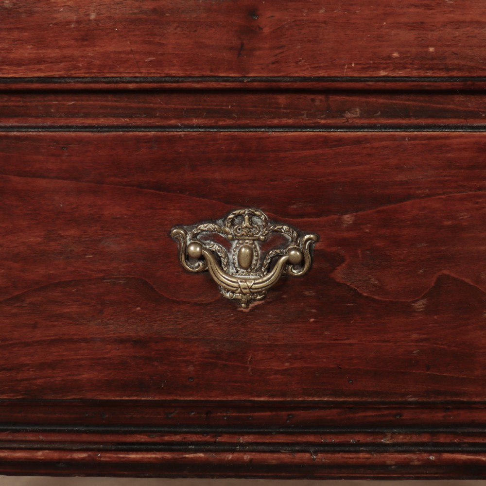 An 18th-century Italian walnut commode with two drawers, raised on tapered square legs with decorative brass fittings. View III