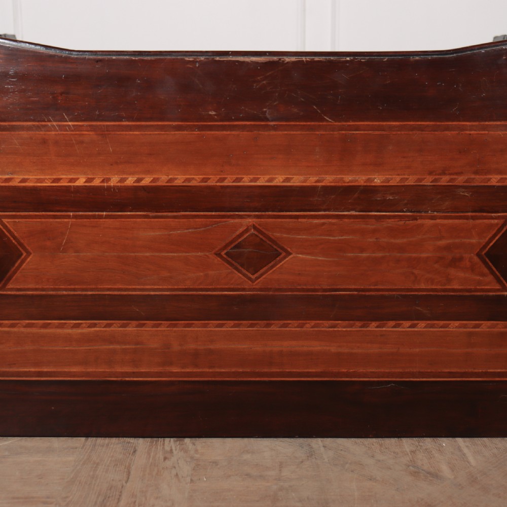 An 18th-century Italian walnut commode featuring four drawers with geometric parquetry inlay and gilt brass pilaster mounts. View XIII