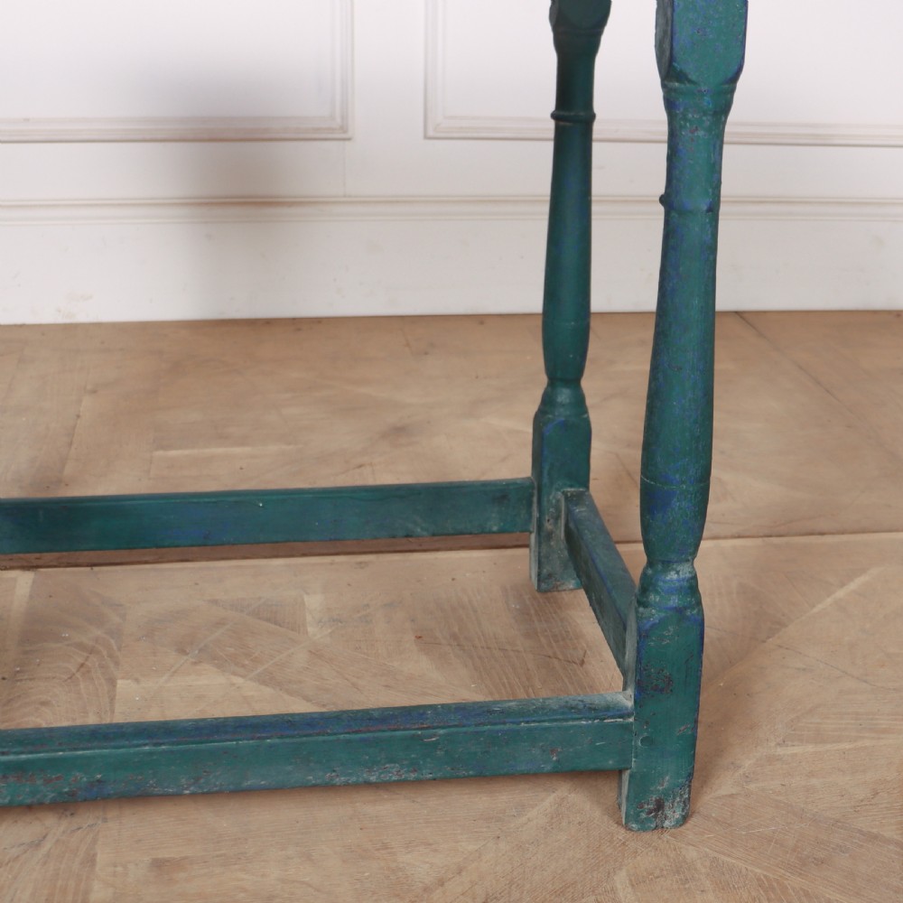 An 18th-century rectangular wooden side table featuring turned legs, box stretchers, and a distressed teal green painted finish. View III