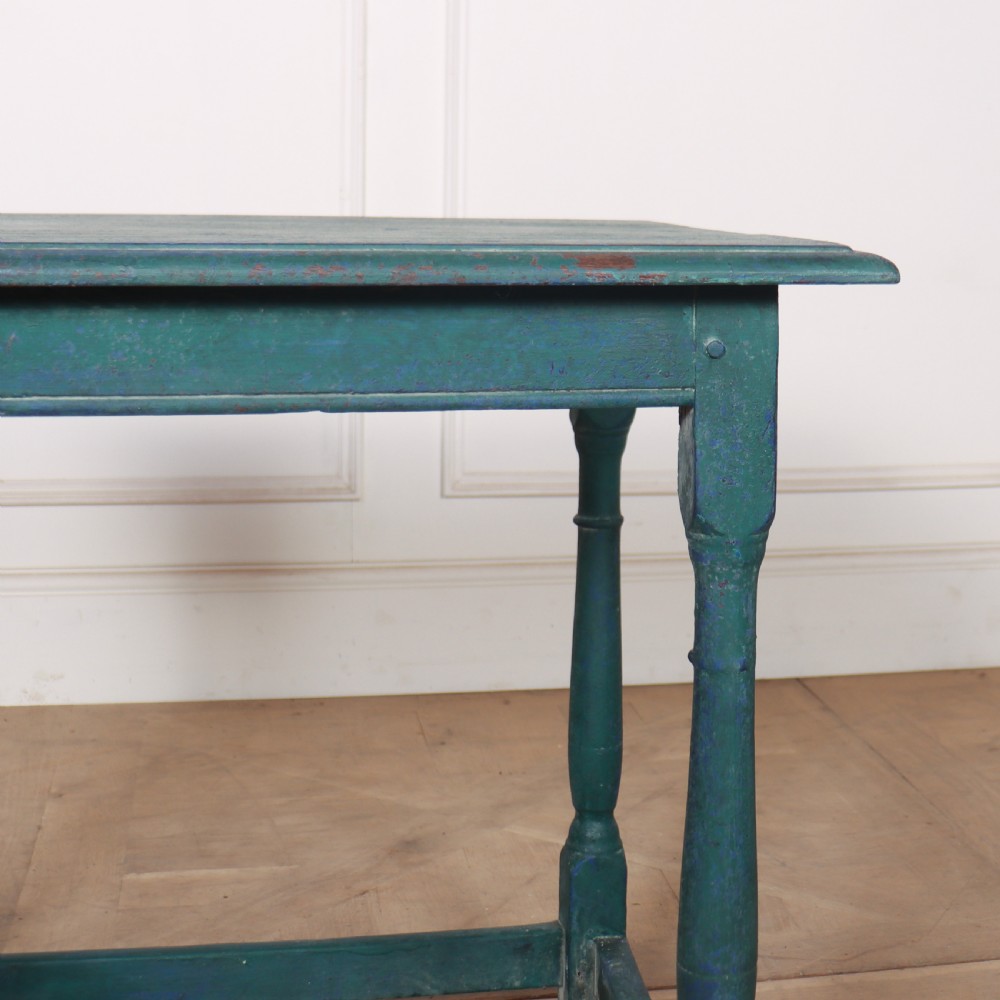 An 18th-century rectangular wooden side table featuring turned legs, box stretchers, and a distressed teal green painted finish. View IV