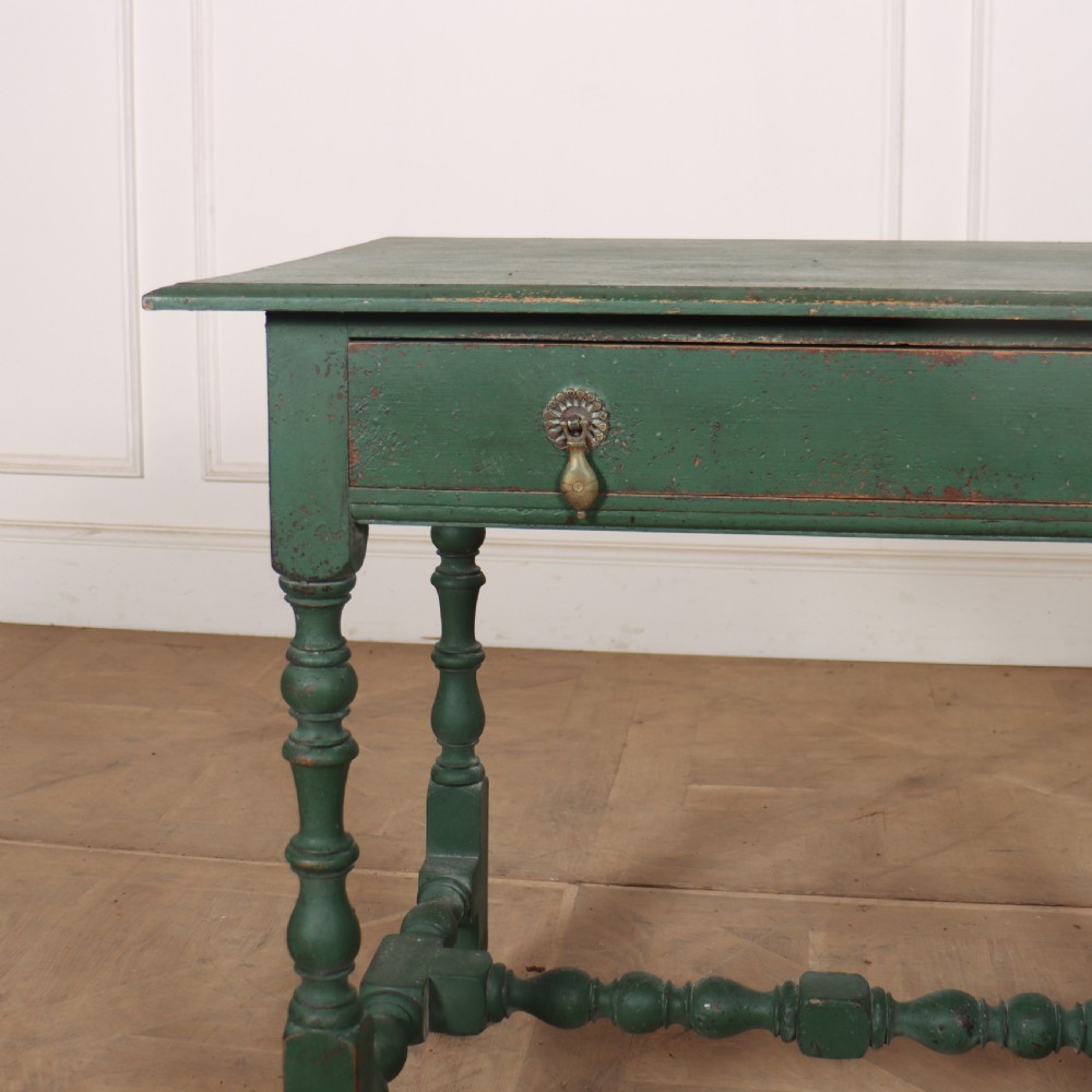 An 18th-century English lamp table featuring a dark green painted surface, single drawer with brass handles, and turned legs with lower stretchers. View II