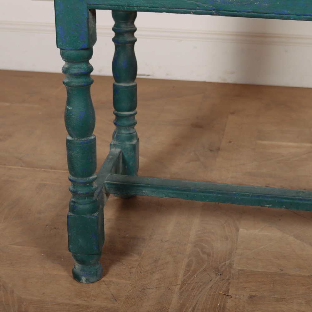 An English side table featuring a weathered teal green painted finish, a single drawer with two round knobs, turned legs, and lower stretchers. View IV