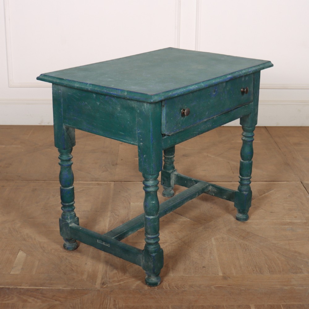 An English side table featuring a weathered teal green painted finish, a single drawer with two round knobs, turned legs, and lower stretchers. View V