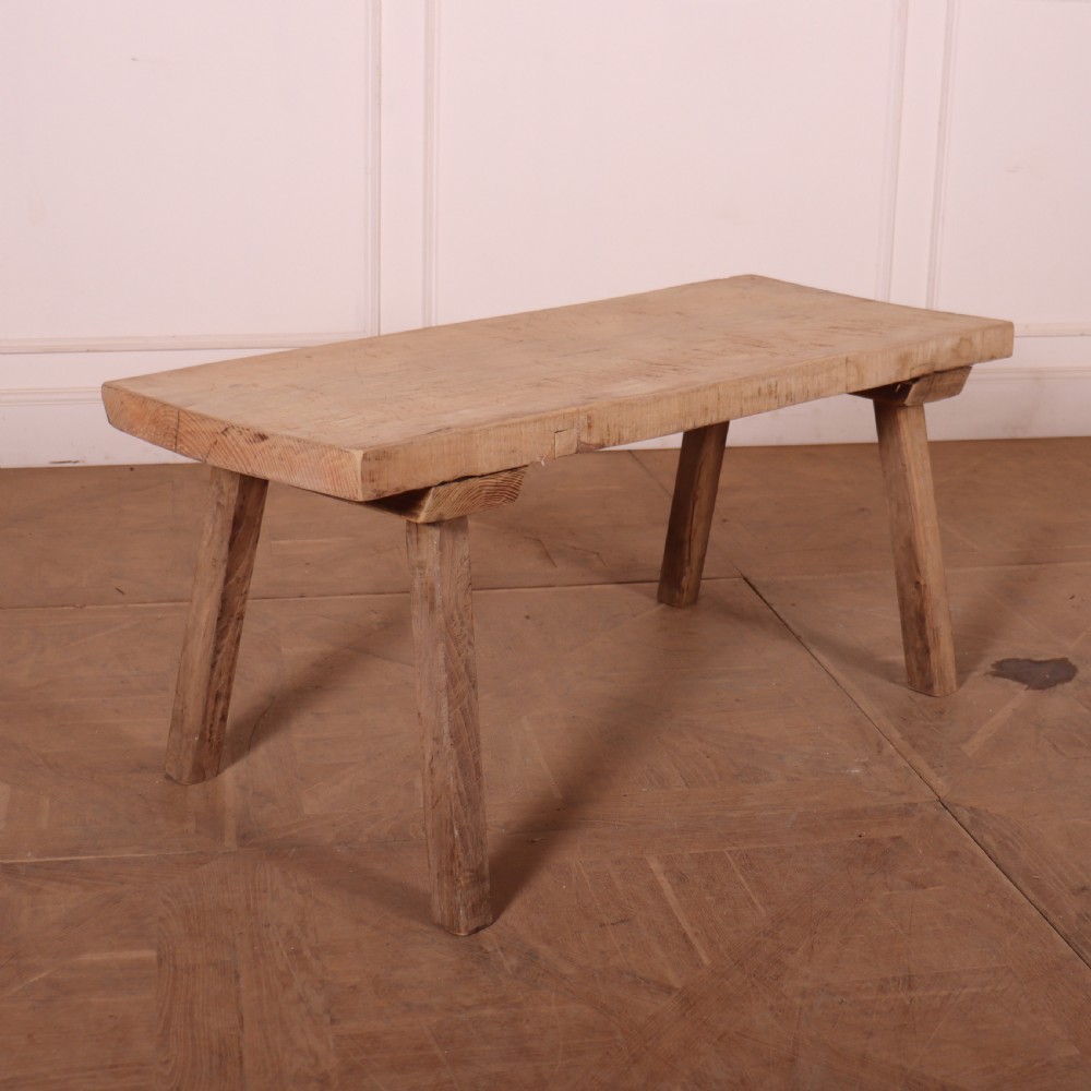 A French rustic trestle table made from scrubbed sycamore and elm with angled splayed legs and a thick rectangular wooden top.