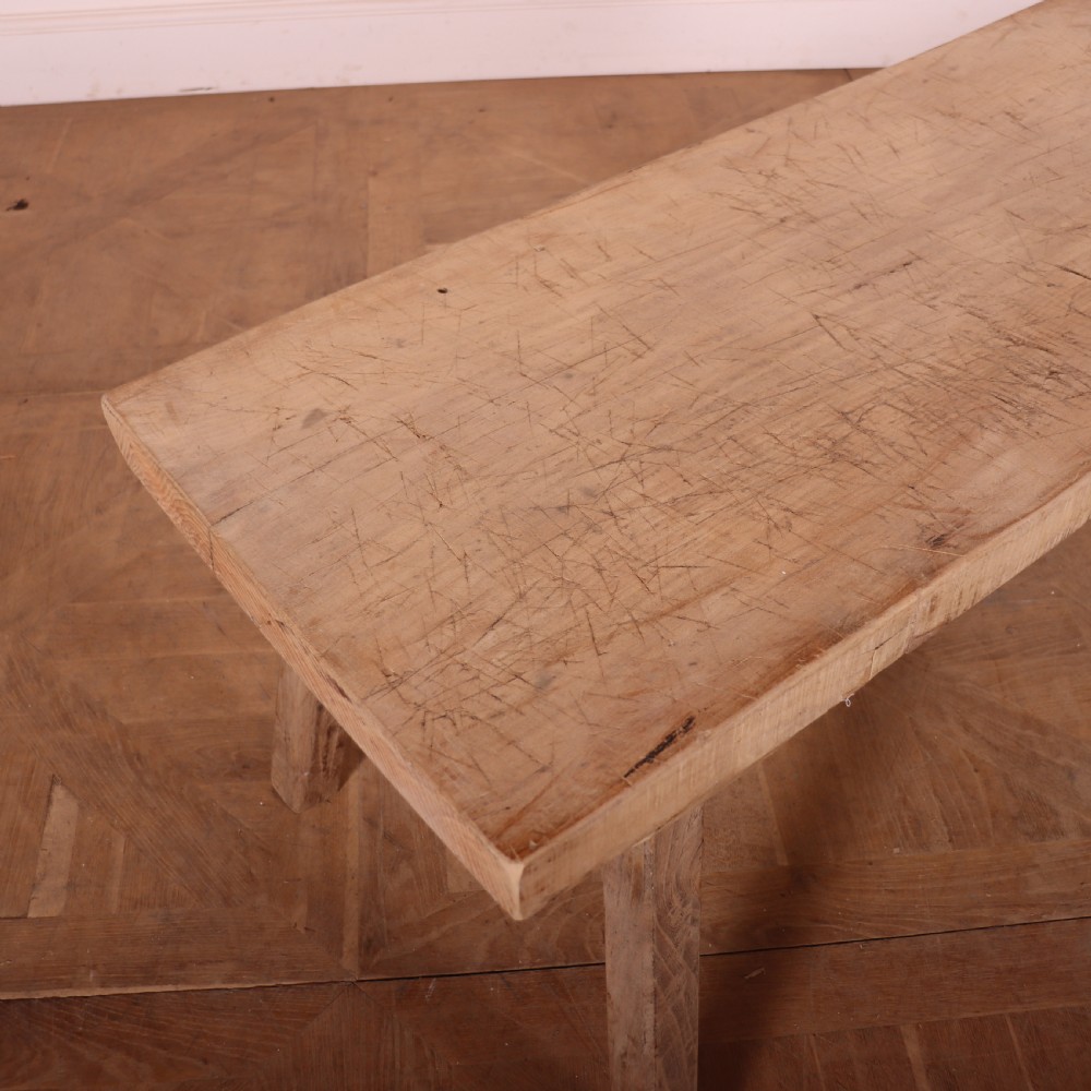 A French rustic trestle table made from scrubbed sycamore and elm with angled splayed legs and a thick rectangular wooden top. View III