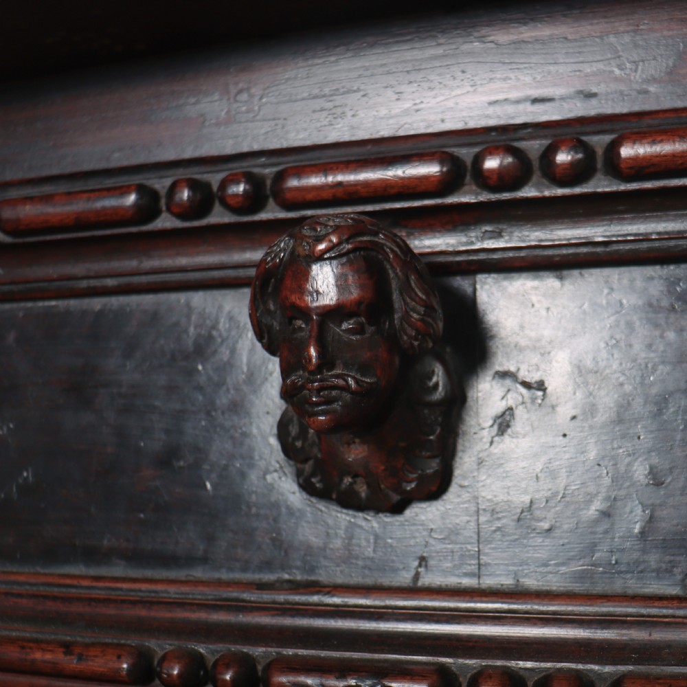 An 18th-century dark walnut Italian commode featuring carved mask pulls, caryatid pilasters, and carved claw feet. View VIII