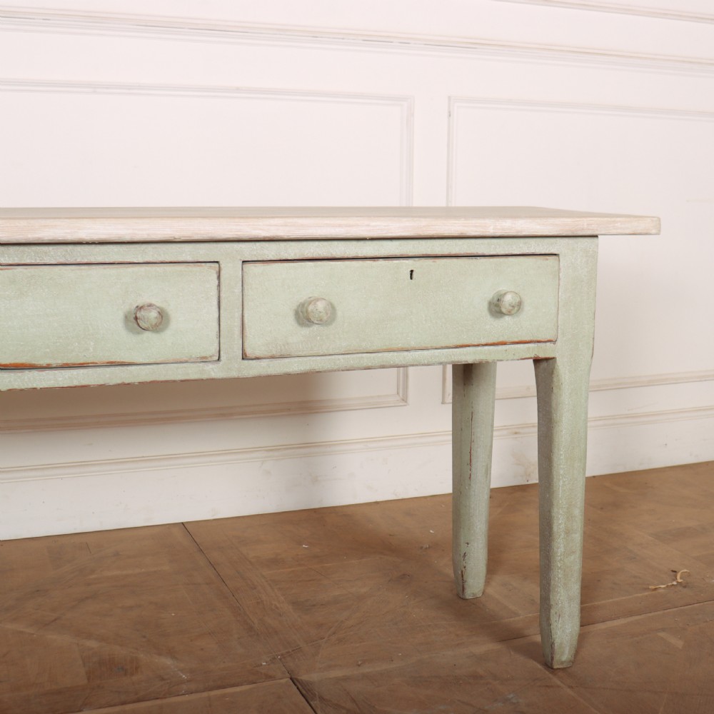 A long narrow wooden console table featuring a pale green painted base, three drawers with wooden turned knobs, and a natural light wood top. View III