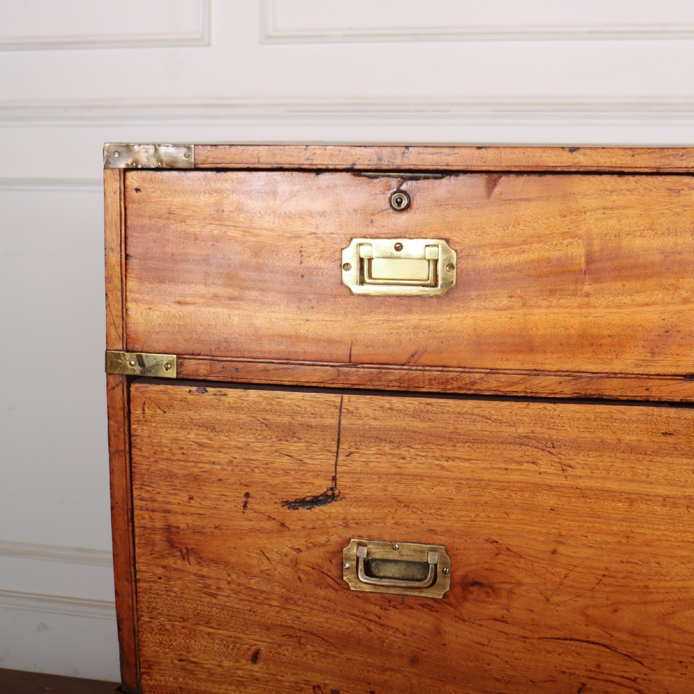 A nineteenth-century two-part military campaign chest of drawers in warm brown timber featuring flush brass handles and corner straps. View III