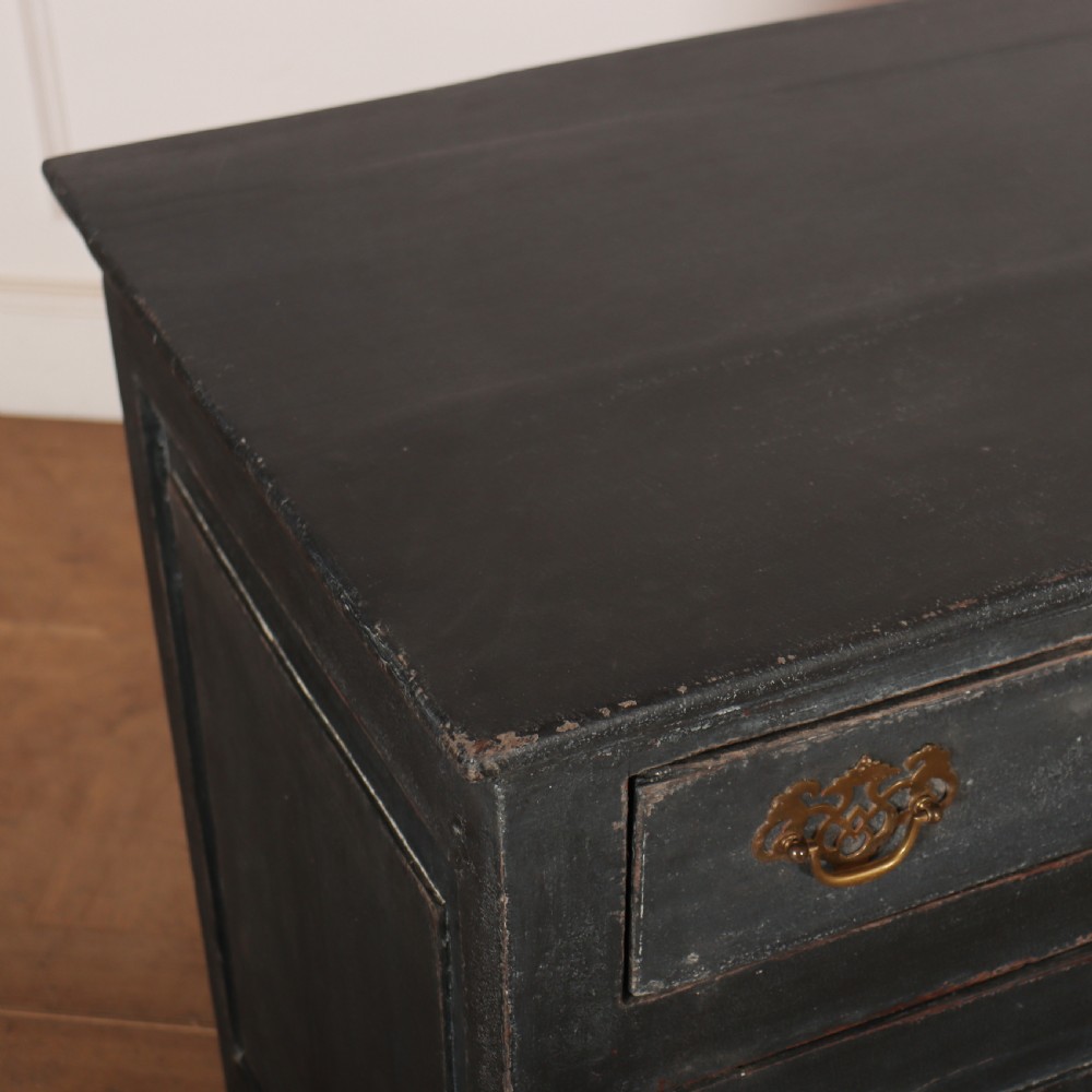 An 18th-century painted wooden dresser base in dark grey featuring three upper drawers with brass swan-neck handles over three cupboard doors with raised panels. View VIII
