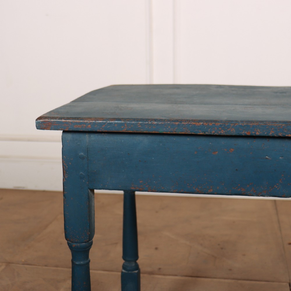 An 18th-century rectangular wooden side table featuring turned legs, a low box stretcher, and a distressed blue painted finish. View II