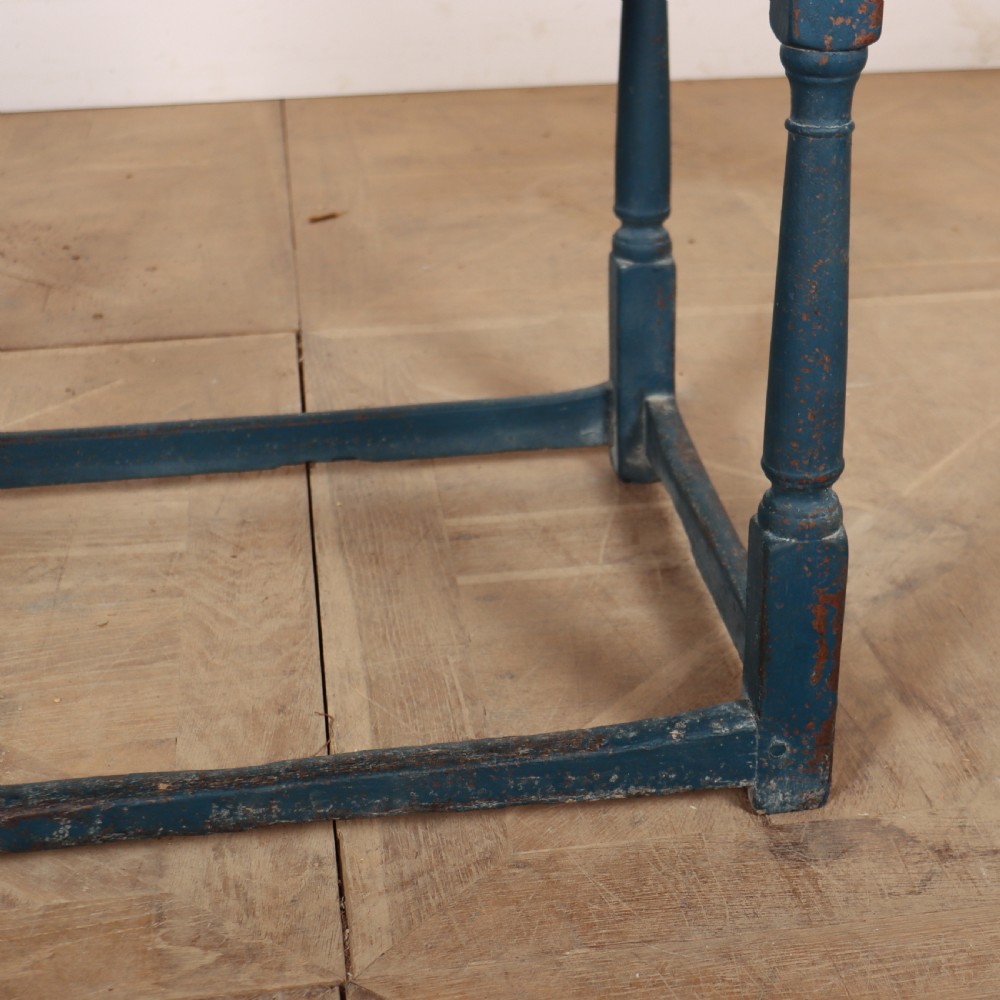 An 18th-century rectangular wooden side table featuring turned legs, a low box stretcher, and a distressed blue painted finish. View IV
