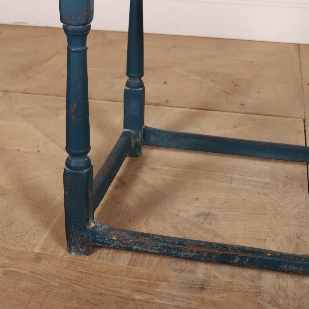 An 18th-century rectangular wooden side table featuring turned legs, a low box stretcher, and a distressed blue painted finish. View VI