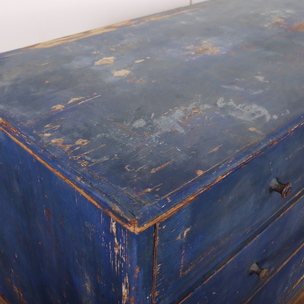 A three-drawer wooden chest of drawers featuring a weathered blue painted finish, small turned knobs, and square tapered feet. View VIII
