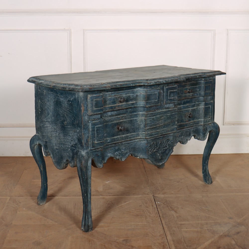 An 18th-century Portuguese serpentine commode featuring a blue painted finish, cabriole legs, and a carved apron. View III
